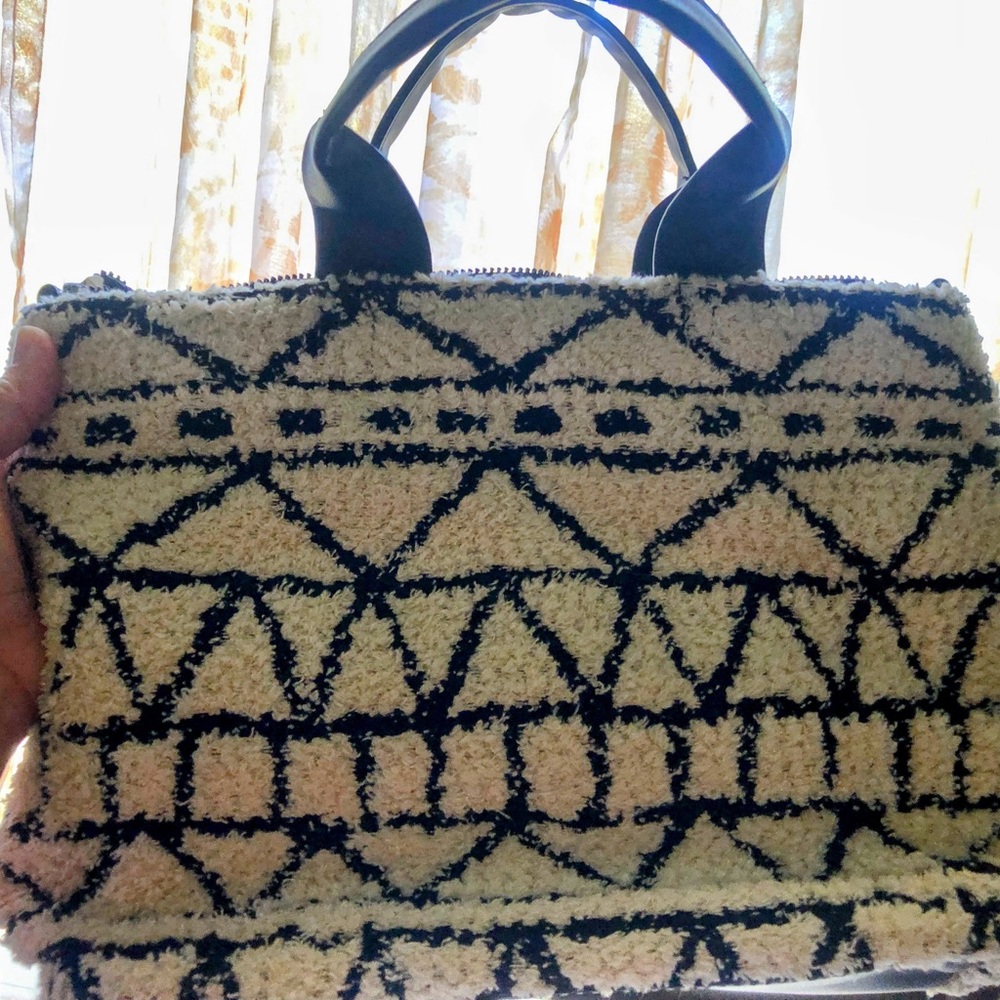 Universal thread, buttery soft cream, and black purse